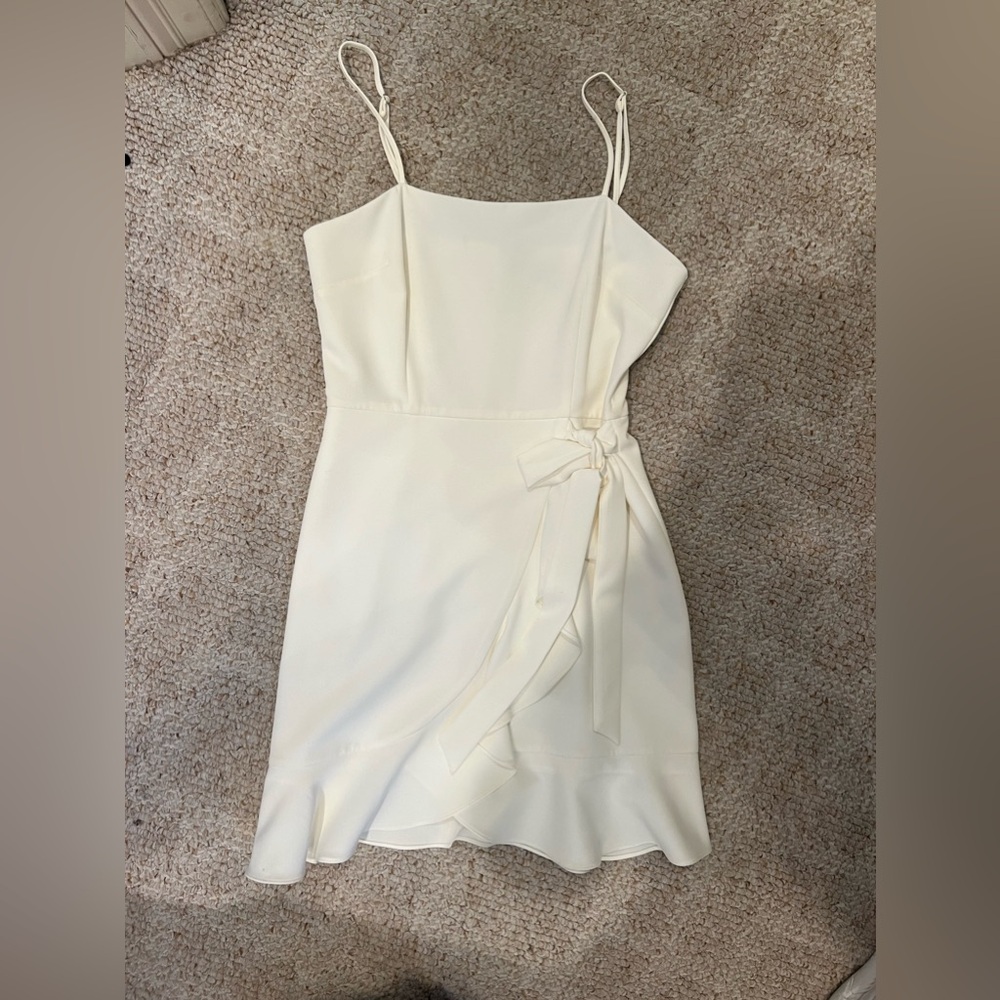 Gianni Bini. Size 4. Worn once. Small stain. Adjustable straps. Ties at waist.